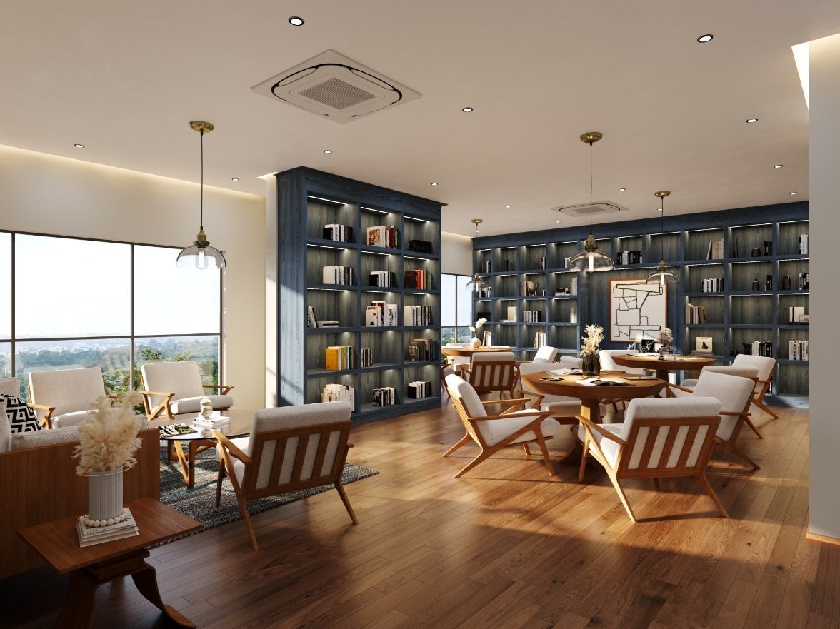 Community library with bookshelves and reading lounge at HeyDay